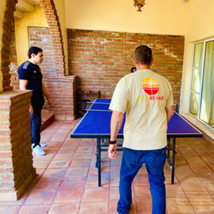 group of people playing ping pong